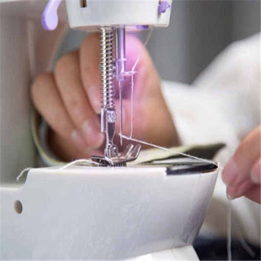 Close-up of a sewing machine needle and foot with a blurred background