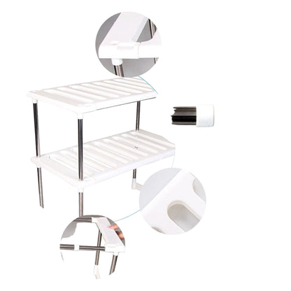 Stainless steel shelf with toilet paper holder on a white background, highlighting material and features.