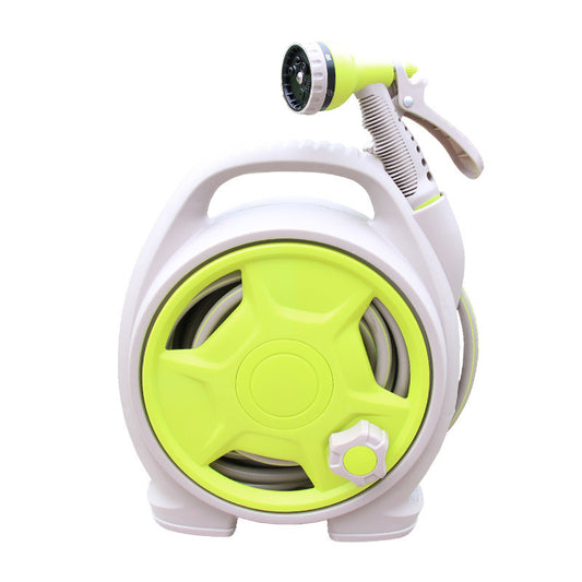 Green and white garden hose reel with spray nozzle on a white background