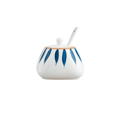Ceramic container with blue leaf patterns and a spoon, shown with dimensions on a white background.