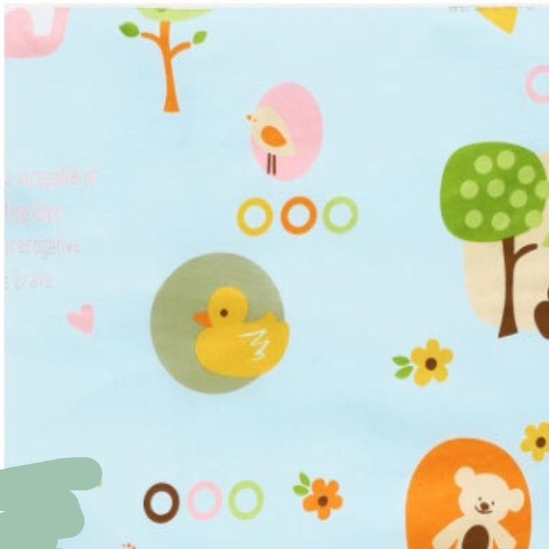 Children's fabric with cartoon animals and objects on a blue background