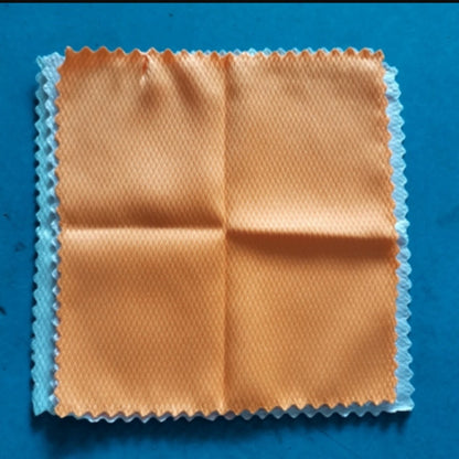 Microfiber cleaning cloth on a blue background
