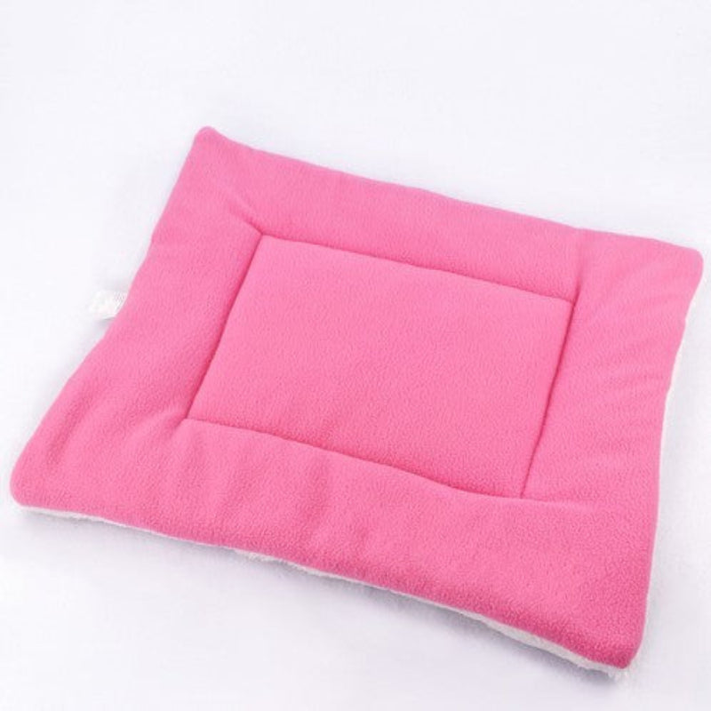 Pink pet bed on a white background