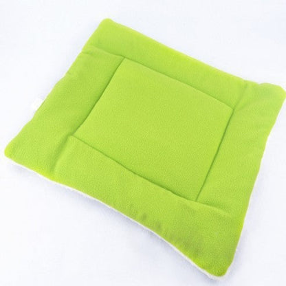 Green cushion on a white background