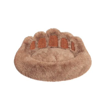 Fur-like paw-shaped pet bed on a white background
