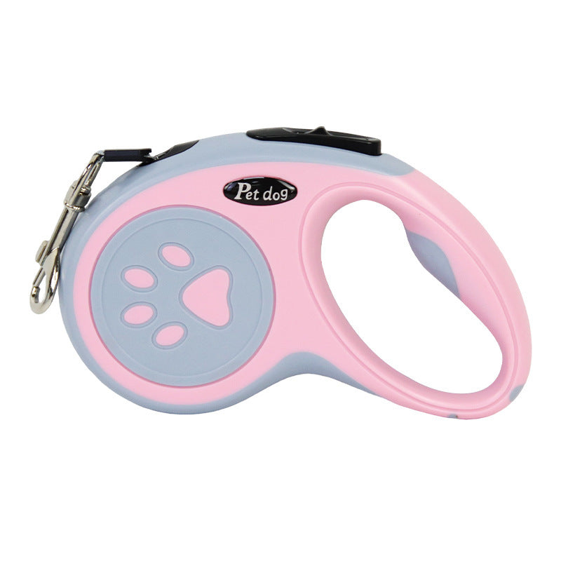 Pink and gray retractable dog leash with paw design on a white background