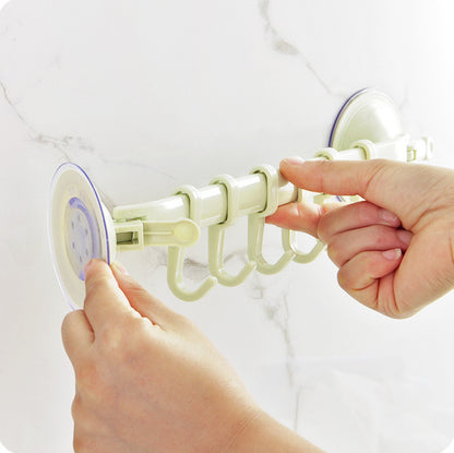 Hand using a shower curtain ring holder on a white background