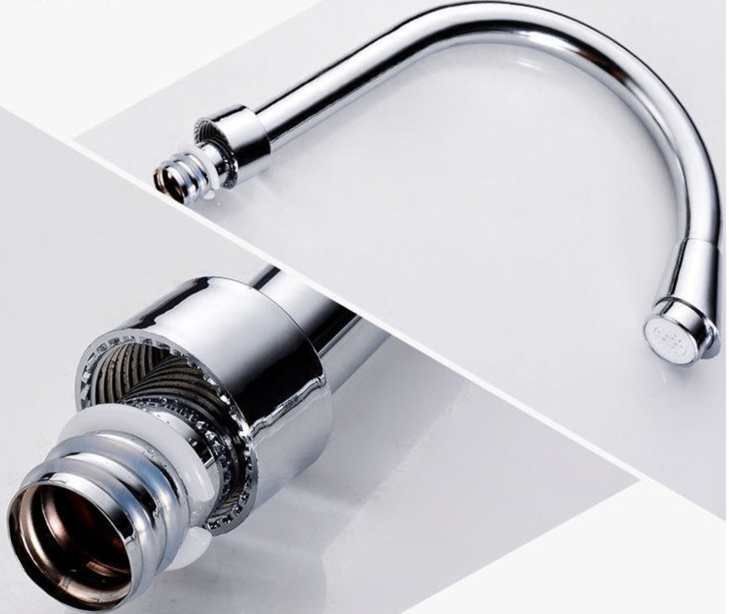 Chrome kitchen faucet on a white background
