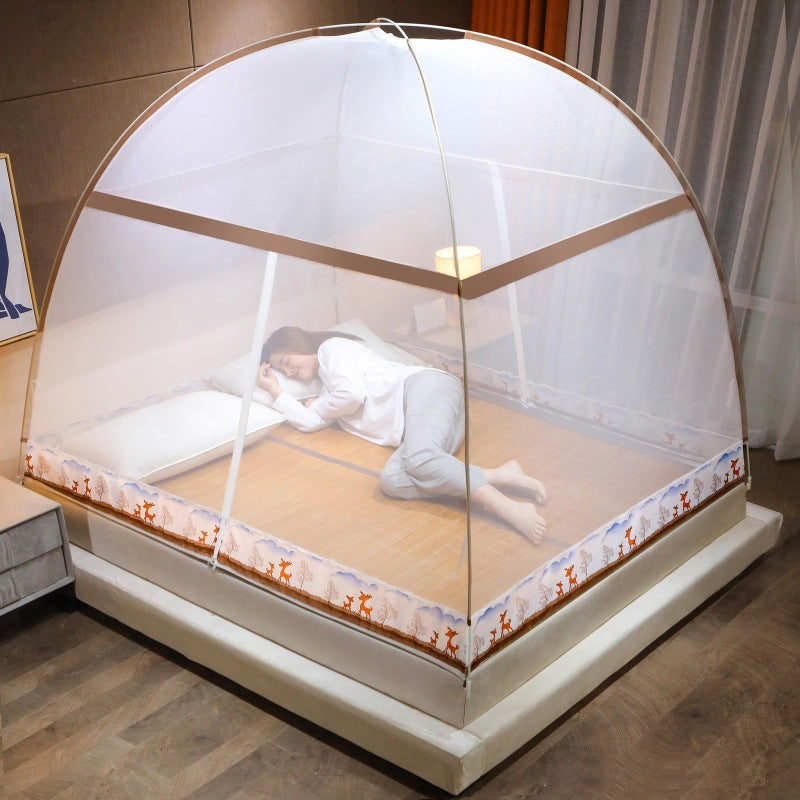 Person lying on a bed with a mosquito net in a bedroom setting
