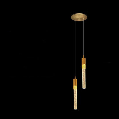 Gold pendant light with measurements on a black background