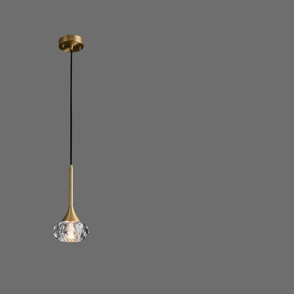 Gold pendant light with adjustable suspension wire on a gray background