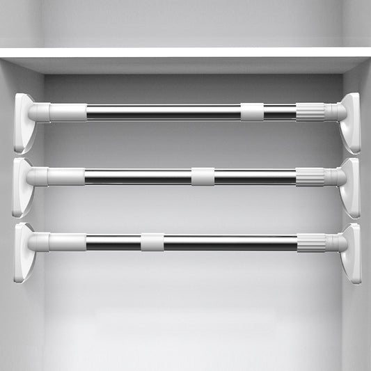 Set of three extendable curtain rods in a white cabinet.