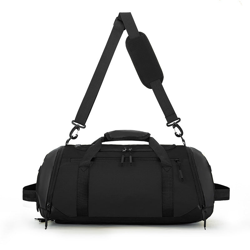 Black duffel bag with a strap on a white background
