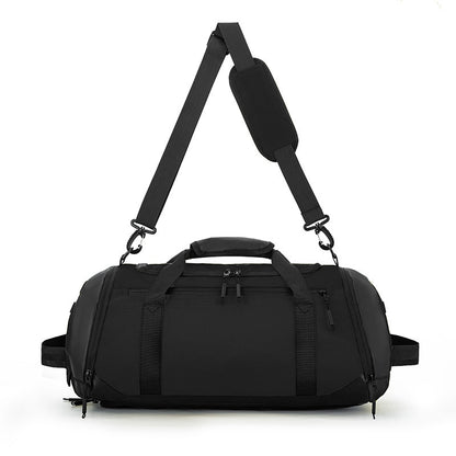 Black duffel bag with a strap on a white background