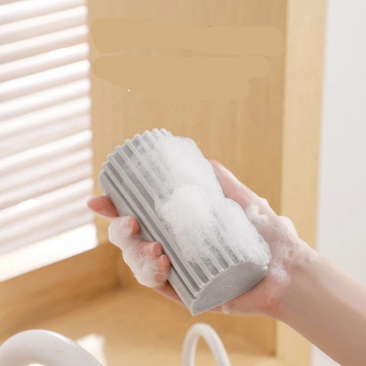 Hand holding a foamy cleaning block with text about foam production.