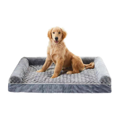 Dog sitting on a gray pet bed with a white background