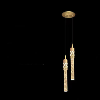 Gold pendant light with measurements on a black background