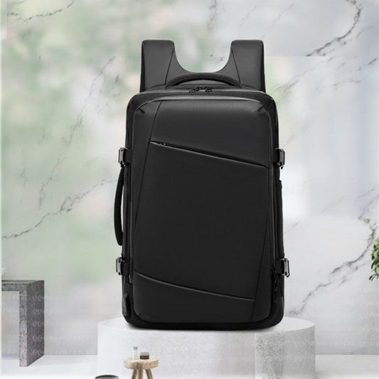 Black backpack on a white pedestal with a marble background