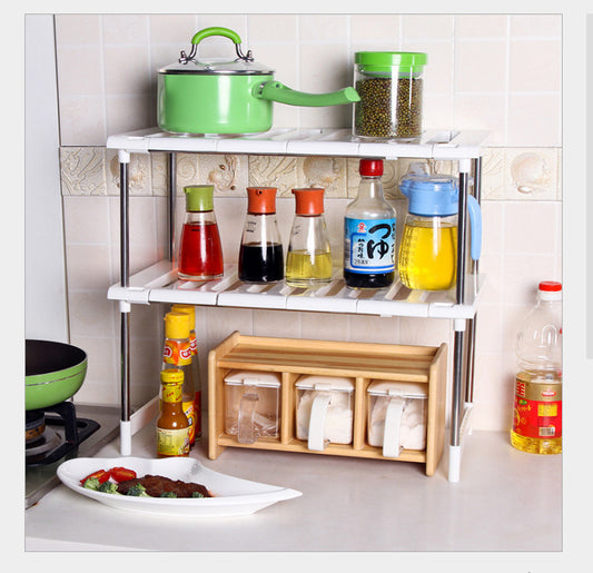 Kitchen shelf with various items including a green pot, bottles, and a wooden rack.