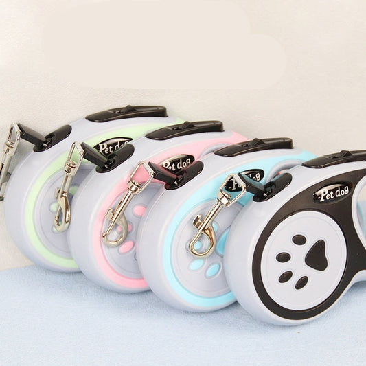 Four pet leashes with different designs on a light background