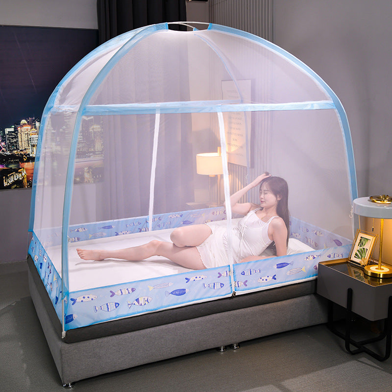 Woman lying on a bed with a blue and white canopy in a room.