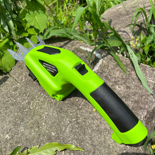 Green and black gardening tool on a stone surface with plants in the background
