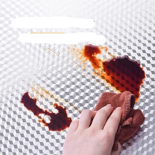 Hand cleaning oil stains on a textured surface with text 'Antifouling and oil-proof' 