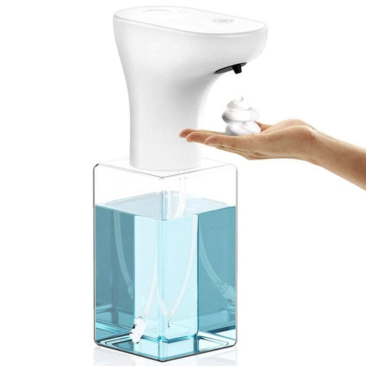 Hand pressing a white and clear soap dispenser with blue liquid.