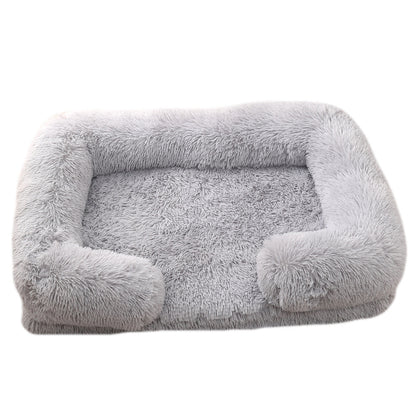 Gray pet bed with fluffy texture on a white background