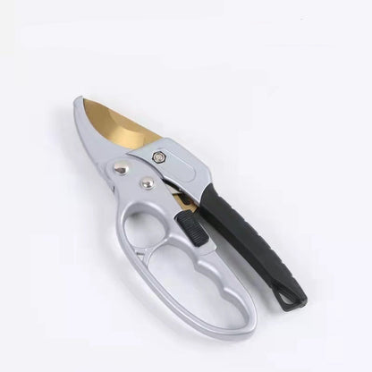 Gardening shears with a gold blade on a white background