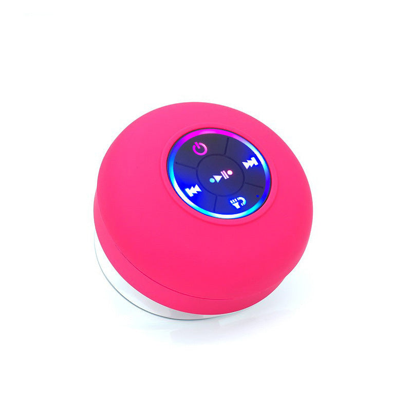 Pink Bluetooth speaker with control buttons on a white background