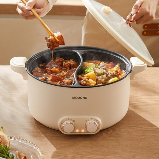 Electric pot with food being stirred, brand 'MODONG' visible