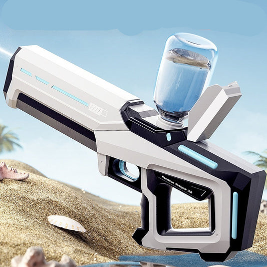 Electric water gun with a glass of water on a beach background