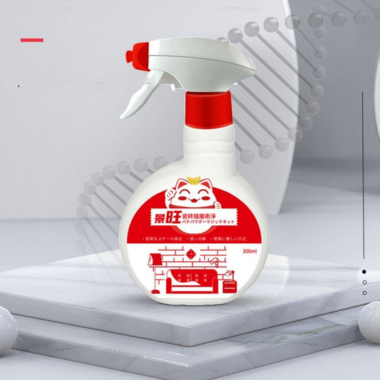 White spray bottle with red nozzle and label on a light gray background
