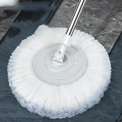 Cleaning tool with white bristle head on a dark surface
