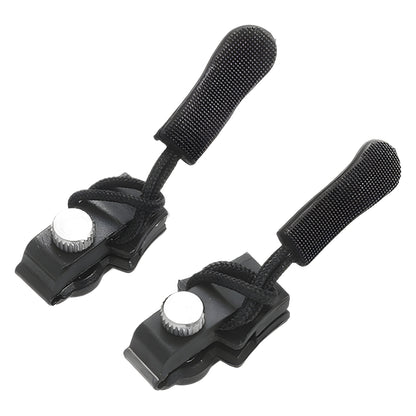 Pair of black ankle or wrist straps with white buttons on a white background