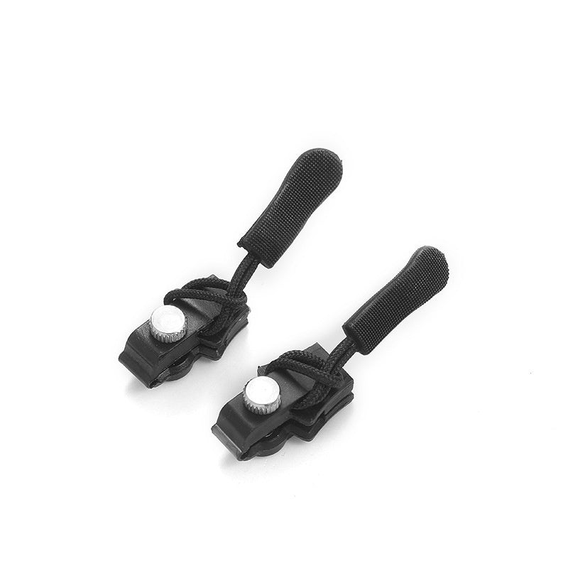 Pair of black straps with white buttons on a white background
