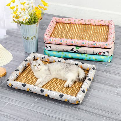 Cat lying on a patterned pet bed with other beds stacked in the background.