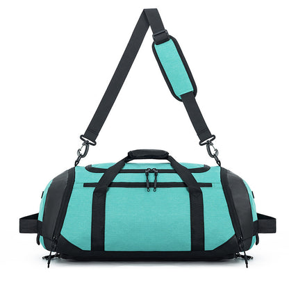 Turquoise duffel bag with black straps on a white background