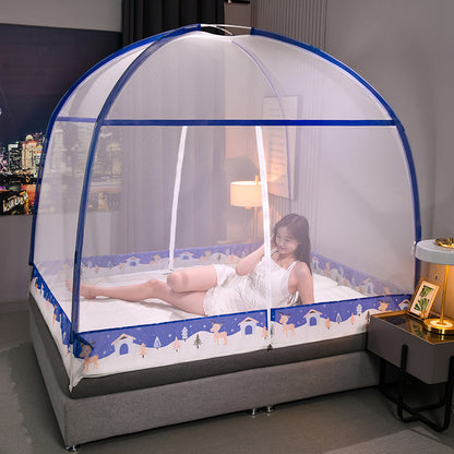 Woman lying on a bed with a blue and white mosquito net in a bedroom setting.