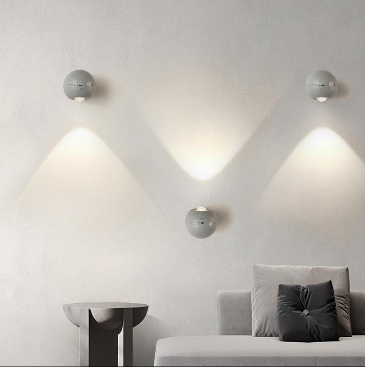 Modern living room with wall-mounted lights creating a personalized lighting space.