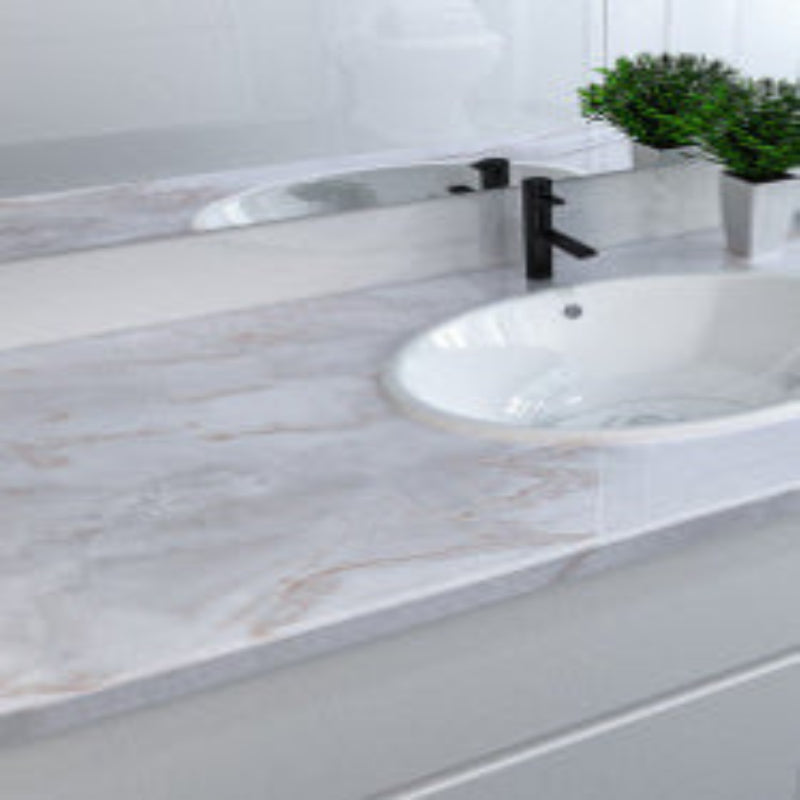 Bathroom sink with marble countertop and faucet