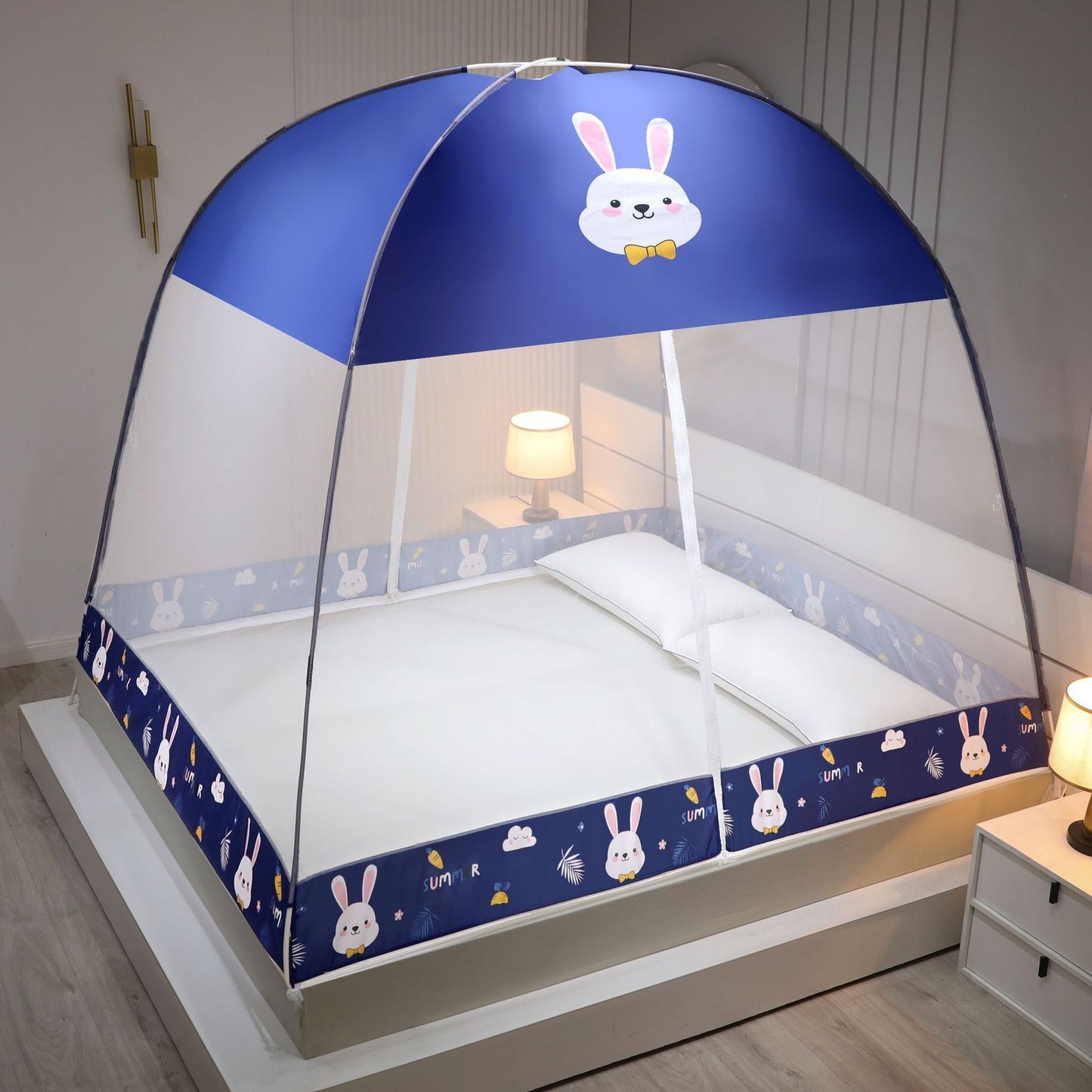 Children's bed with a blue cartoon rabbit design on a white background