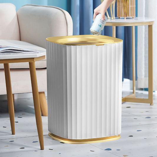 White trash can with gold rim in a living room setting