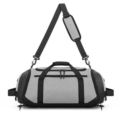 Gray duffel bag with black straps on a white background