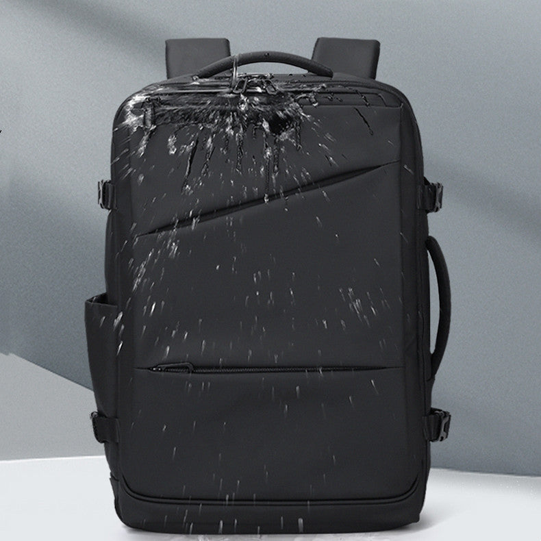 Black backpack with water splashes on a gray background