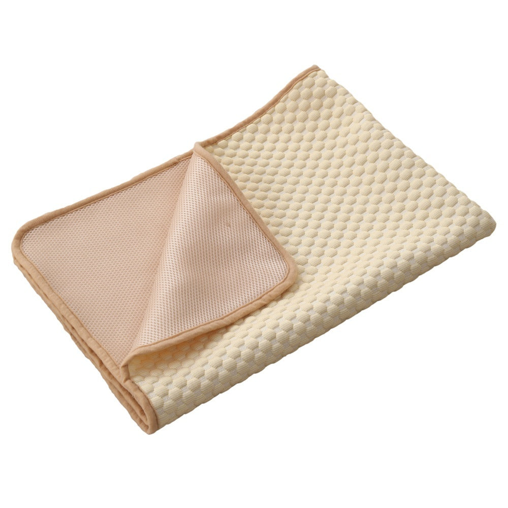 Beige quilted blanket on a white background