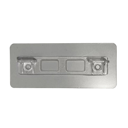 Plastic rectangular object with embedded components on a white background