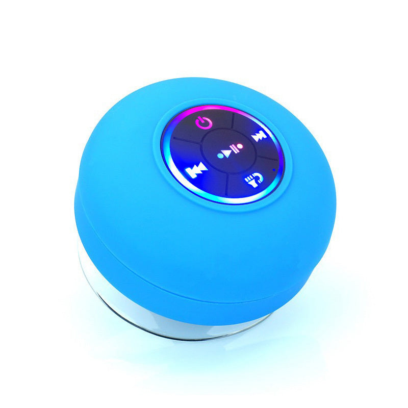 Blue portable speaker with control buttons on a white background