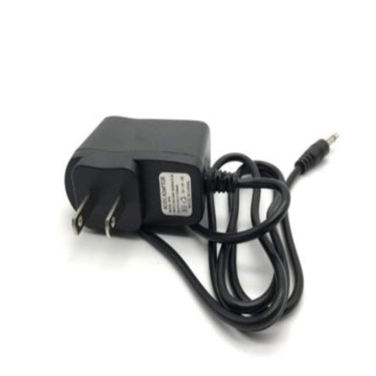 Black power adapter with a cable on a white background